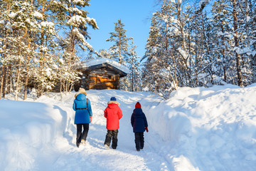 Canvas Print - Mother and kids outdoors on winter