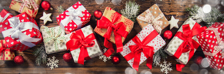 christmas gift boxes placed on wooden planks