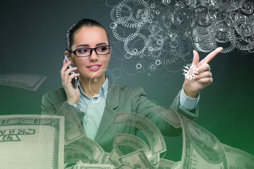 Wall Mural - Businesswoman with dollars talking on mobile phone