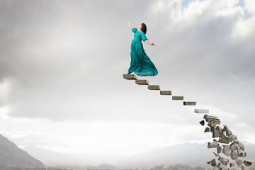 Wall Mural - Woman levitating in sky . Mixed media