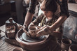© gstockstudio - Learning from confident potter.