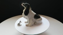 Two Porcelain Statuettes Dogs On A Rotating Table
