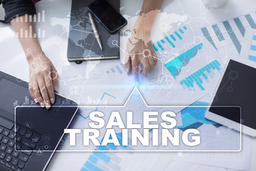 Wall Mural - woman is working with documents, tablet pc and notebook and selecting sales training.