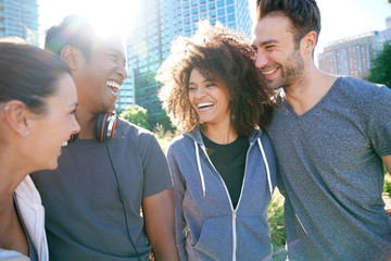 Wall Mural - Group of friends having fun at the park ready to jog