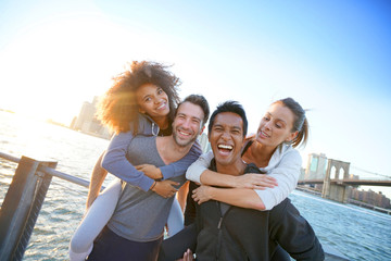 Wall Mural - Group of friends enjoying sunset on Brooklyn heights promenade, NYC