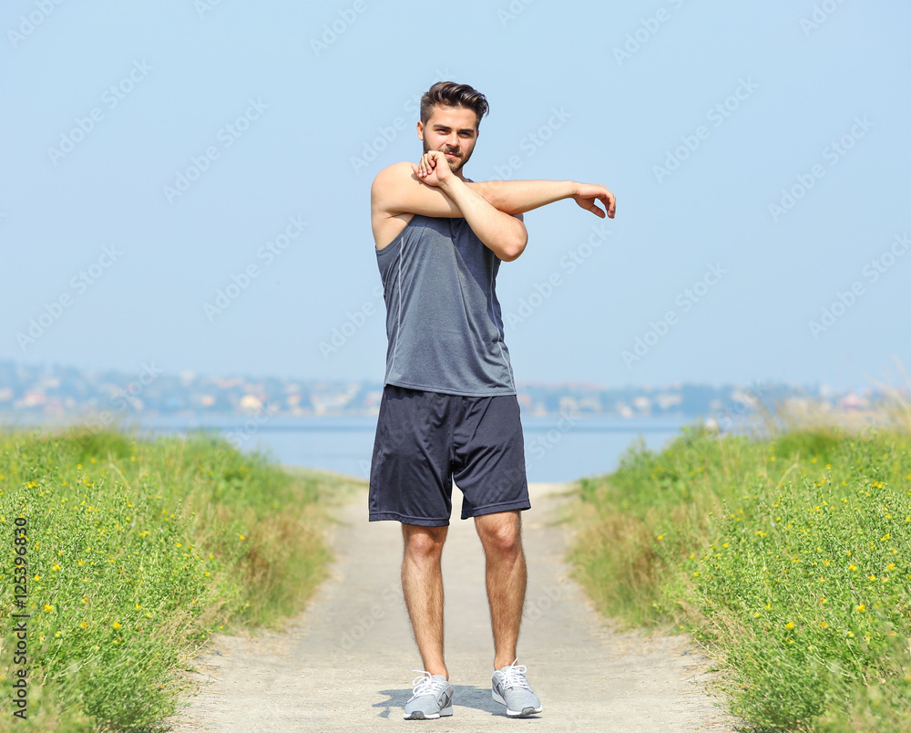 Young man doing workout outdoors