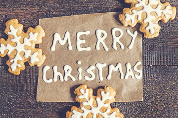 Christmas gingerbread cookies and inscription on a dark backgrou