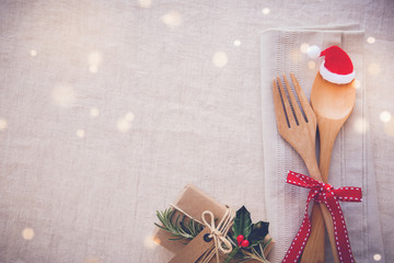 Wall Mural - Christmas table place setting, holidays copy space fairy light toning background
