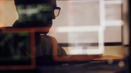 double exposure shot of man hacker with glasses working at computer