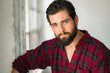 © elnariz - Head shot portrait of an easy going casual man with beard flannel mellow lovable gentle