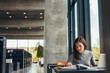 © Jacob Lund - Female student doing assignments in library