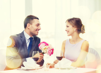 Sticker - smiling man giving flower bouquet at restaurant