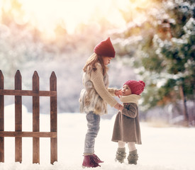 Poster - girls playing on a winter walk