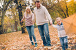 © chika_milan - Dad, mom and son  flying a kite in nature