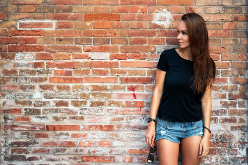 An Outdoor Portrait Of A Young Pretty Hipster Girl With Long Dark