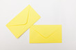 yellow letter envelopes on white backgrounds