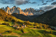 Santa Maddalena village in front of the Geisler or Odle Dolomites Group on sunset, Val di Funes, Italy, Europe.