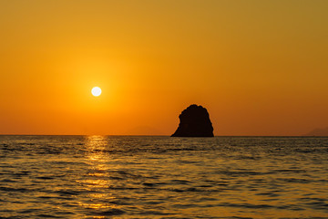 Wall Mural - lonely rocks in sea between lipari and volcano, Sicily