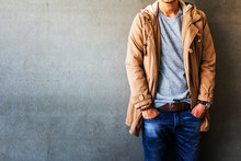 Men's Casual Outfits Standing Over Gray Grunge Background With Space, Beauty And Fashion Concept