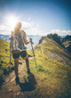 © XtravaganT - Peaceful view of lone female hiker walking up path