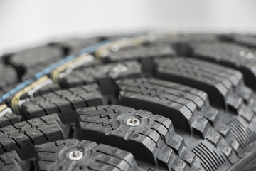 Snow spike, macro, winter car tire  with depth of field