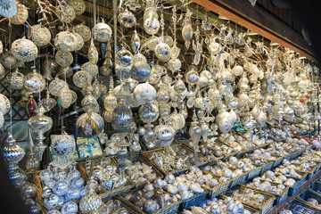 Colorful close up details of christmas fair market. Balls decora