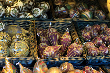 Colorful close up details of christmas fair market. Balls decora