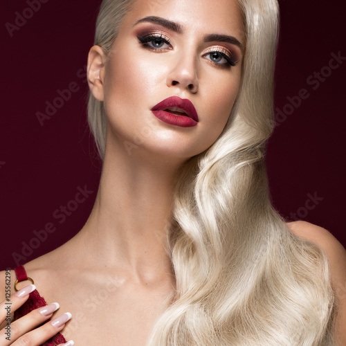 Beautiful blonde in a Hollywood manner with curls, red lips, red lingerie Plakat