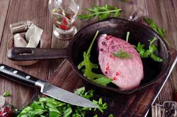 Wall Mural - Pieces of fresh raw meat in a frying pan