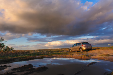 Wall Mural - Beautiful cloudy sky and car