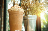 Iced coffee with whipped cream and sprinkle with almonds