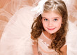 © svetamart - Adorable smiling little girl in white princess dress