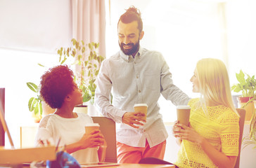 Canvas Print - happy creative team drinking coffee in office