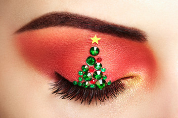 Wall Mural - eye girl makeover christmas tree. winter christmas makeup. beauty fashion. eyelashes. cosmetic eyesh