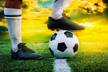 Feet Of Football Player Tread On Soccer Ball