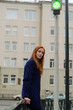 © retoncy - Young red woman walking in the city