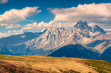 Fototapete - Colorful autumn landscape with shepherd house and green tourist