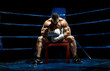 © tankist276 - boxer on boxing ring, tired time-out