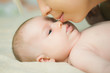 © Volodymyr - Mother kissing her son newborn