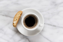 Overhead View Of Black Coffee Cup And Saucer On Marble