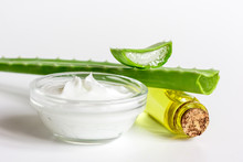 Extract From Aloe Vera In Glass Bottle And Cream Macro