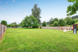 Large spacious backyard area, filled with green grass