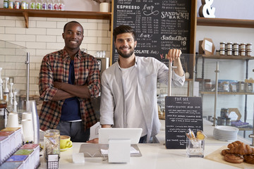 Wall Mural - Business partners at the counter of a coffee shop, close up