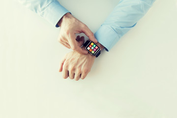 Canvas Print - hands with application icons on smart watch