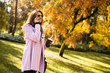 © BGStock72 - Modern woman in autumn park