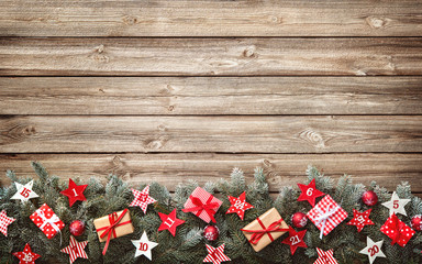 Wall Mural - fir tree branches with advent calendar stars and gift boxes