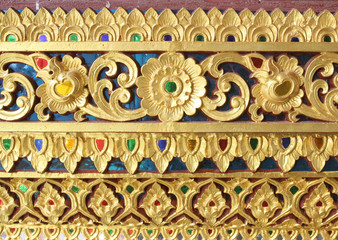 Wall Mural - traditional Thai style art gold painting pattern on the wall