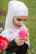 © seriff - Beutiful Girl With Hijab Posing with rose in nature