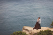 © anna_gorbenko - Romantic and stylish caucasian couple standing on the background of spectacular sea view. Love, relationships, romance, happiness concept.