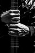 © princeoflove - musician hands holding guitar, black and white filter for music background